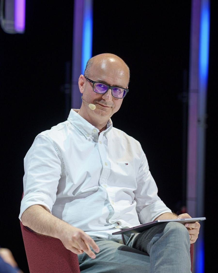 Radu Puchiu listening during a session at IQ Digital Summit, Cluj